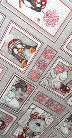 Vista del estampado de pingüinos y osos polares con detalles rojos sobre loneta gris