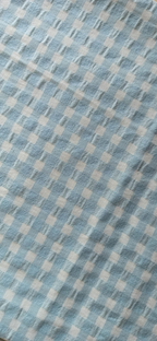 Textura del retal seersucker bicolor azul y vainilla